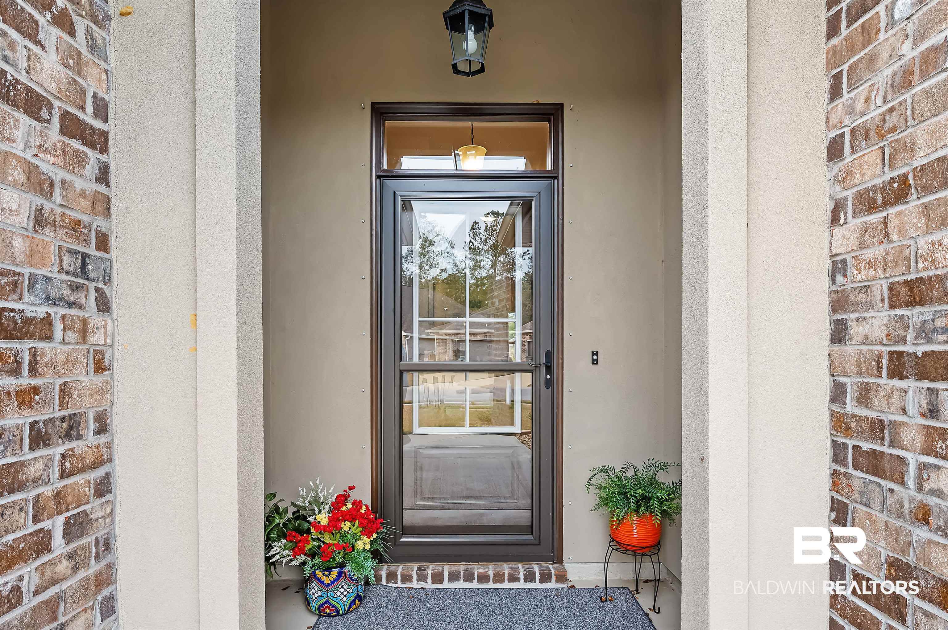 1271 Surrey Loop Foley, AL 36535 - Photo 7 of 23 Inviting Front entrance and glass enclosure