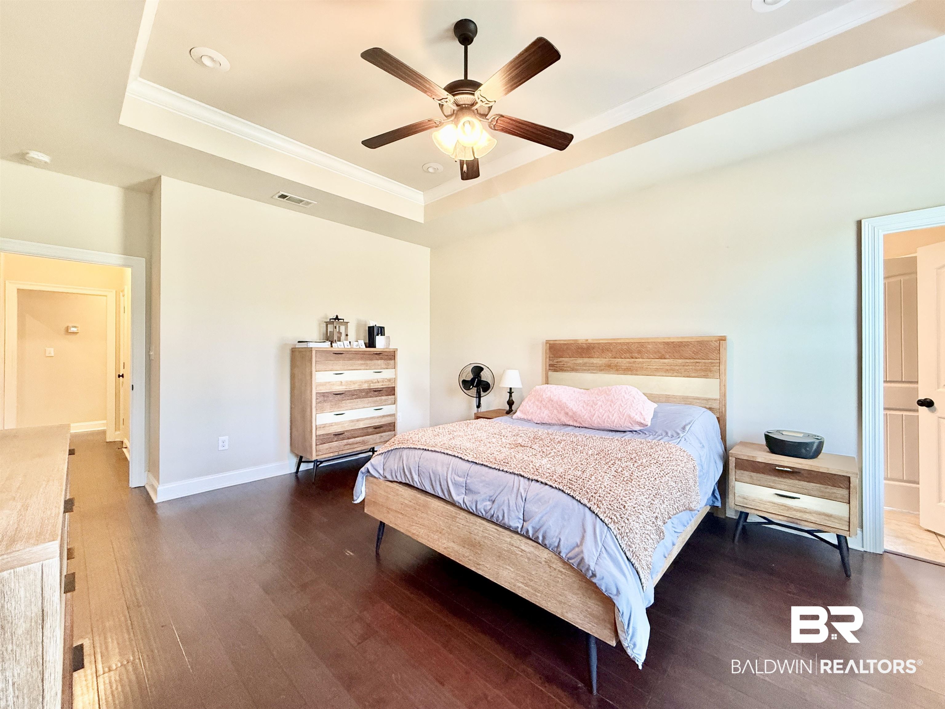 7011 Rocky Rd Loop Gulf Shores, AL 36542 - Photo 25 of 66 Bedroom featuring a raised ceiling, ornamental molding, dark wood-style floors, ceiling fan, and recessed lighting