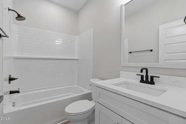 an empty room with a window and ceiling fan