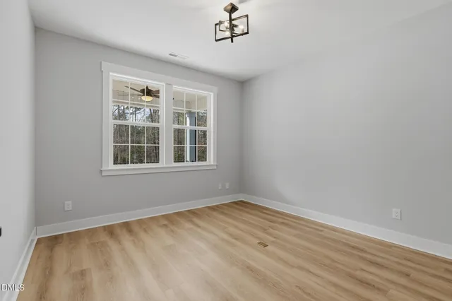 a view of empty room with windows