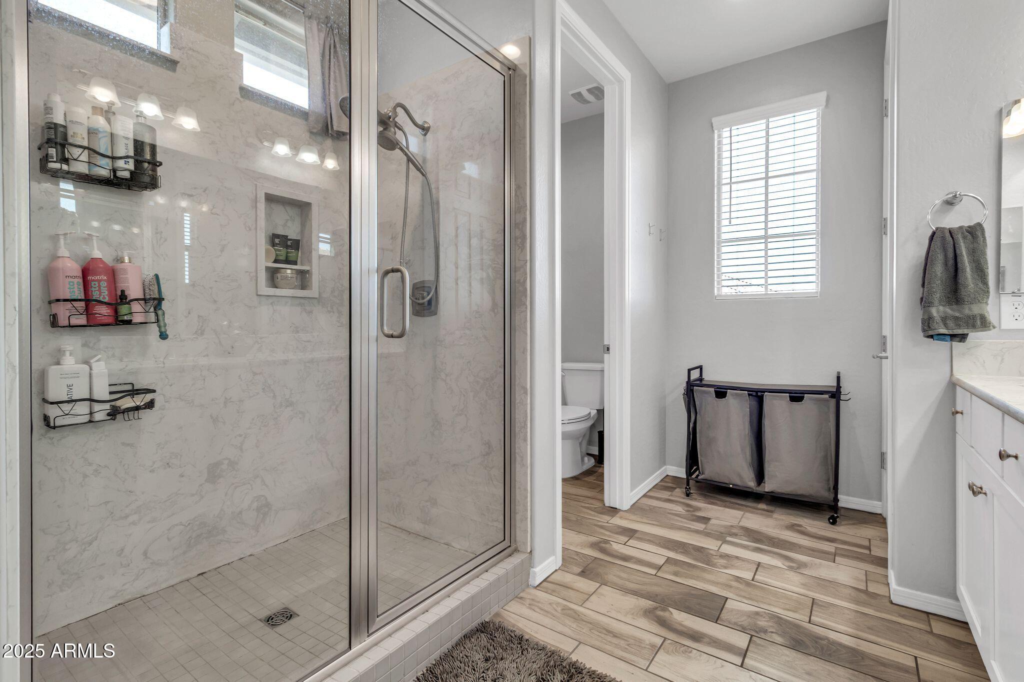 4145 East Bethena Street Gilbert, AZ 85295 - Photo 21 of 60 a bathroom with a shower