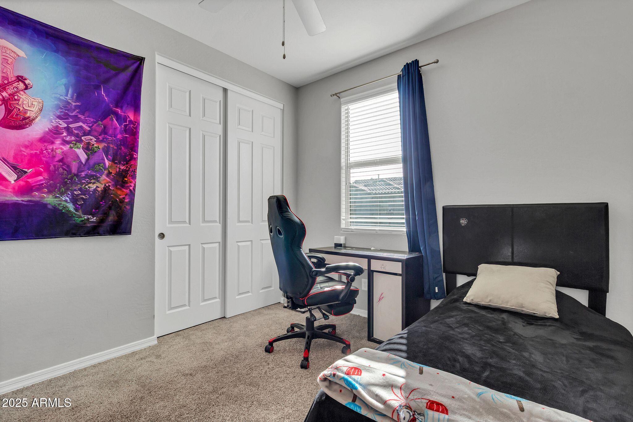 4145 East Bethena Street Gilbert, AZ 85295 - Photo 26 of 60 a view of a workspace with furniture and a window