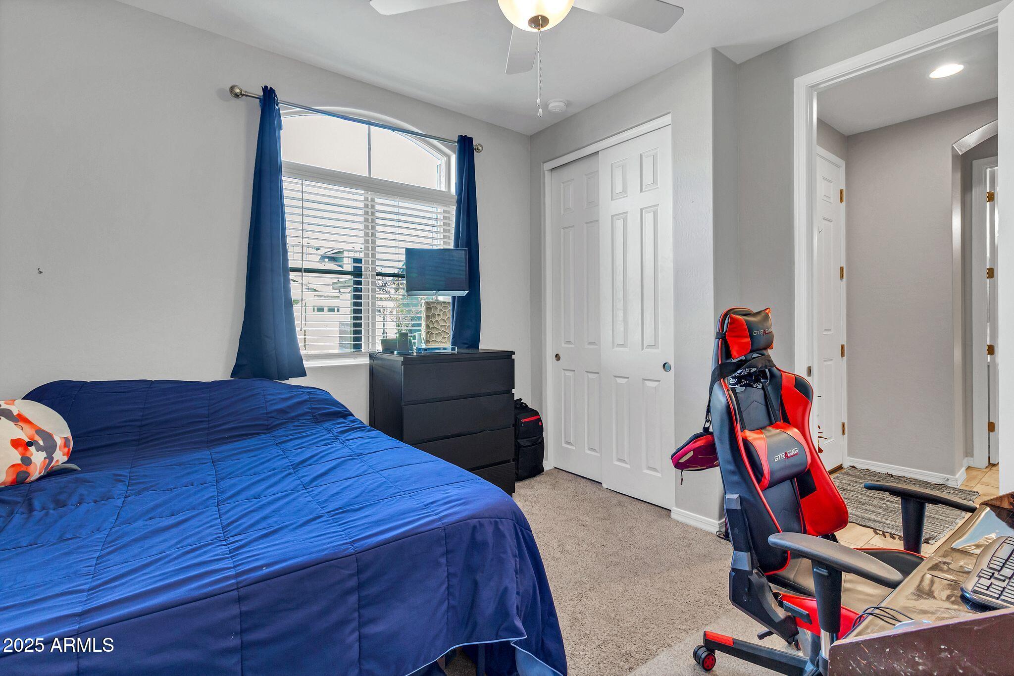 4145 East Bethena Street Gilbert, AZ 85295 - Photo 35 of 60 a bedroom with a bed and a window