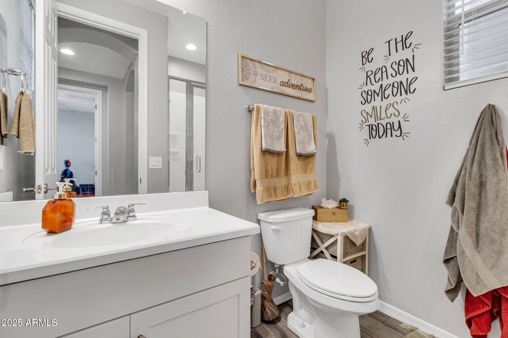 4145 East Bethena Street Gilbert, AZ 85295 - Photo 37 of 60 a bathroom with a sink and a mirror