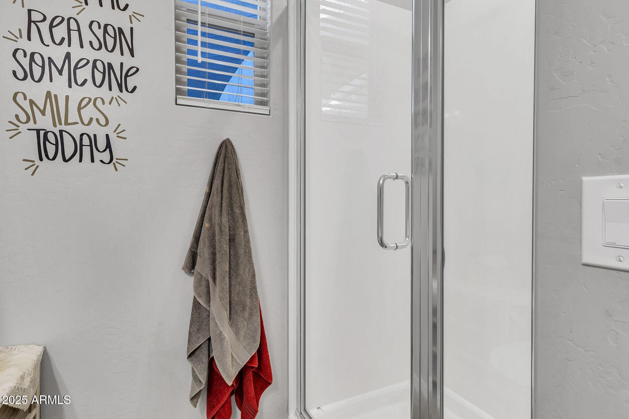 4145 East Bethena Street Gilbert, AZ 85295 - Photo 38 of 60 a view of walk in closet with clothes