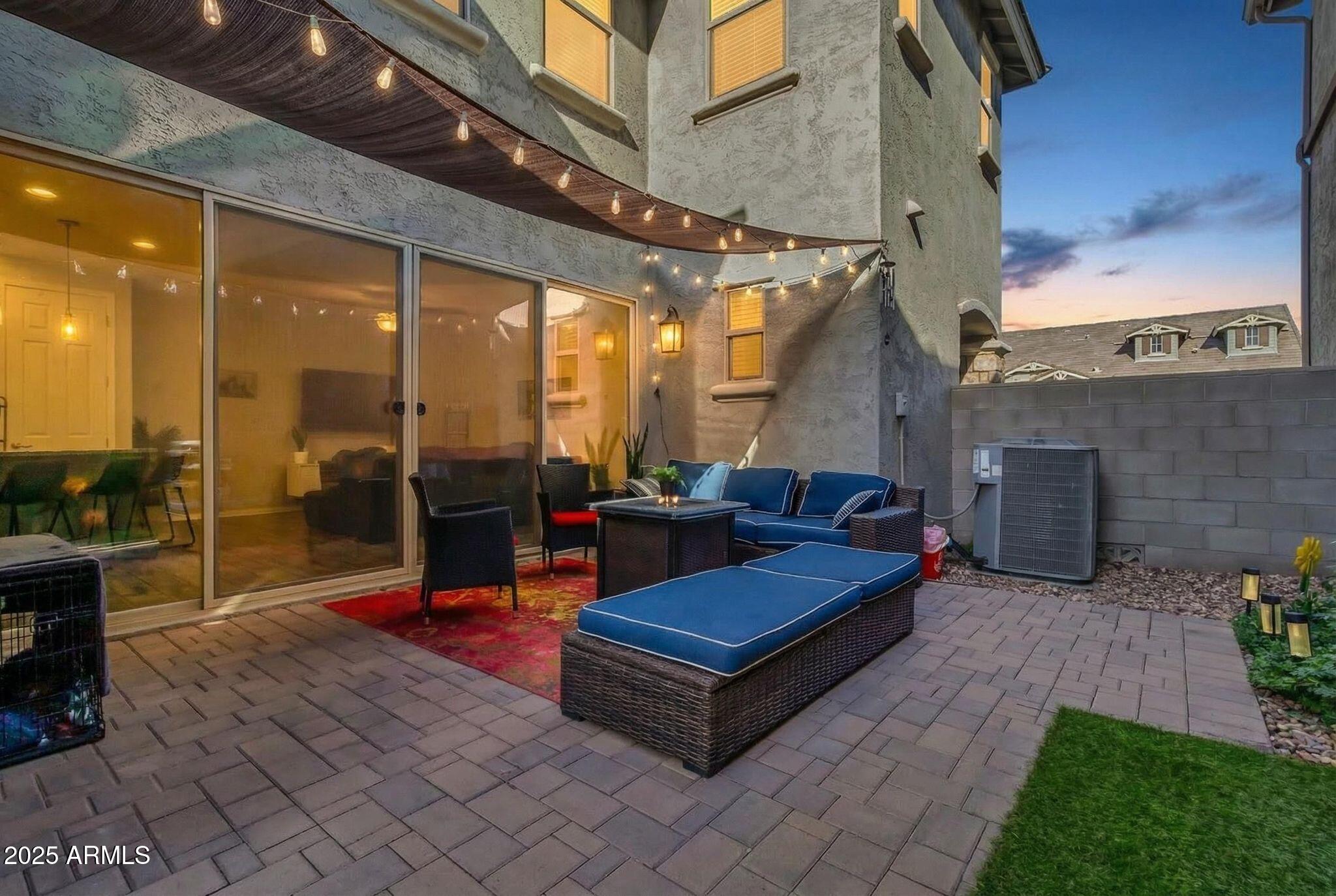 4145 East Bethena Street Gilbert, AZ 85295 - Photo 39 of 60 a building outdoor space with patio furniture and potted plants