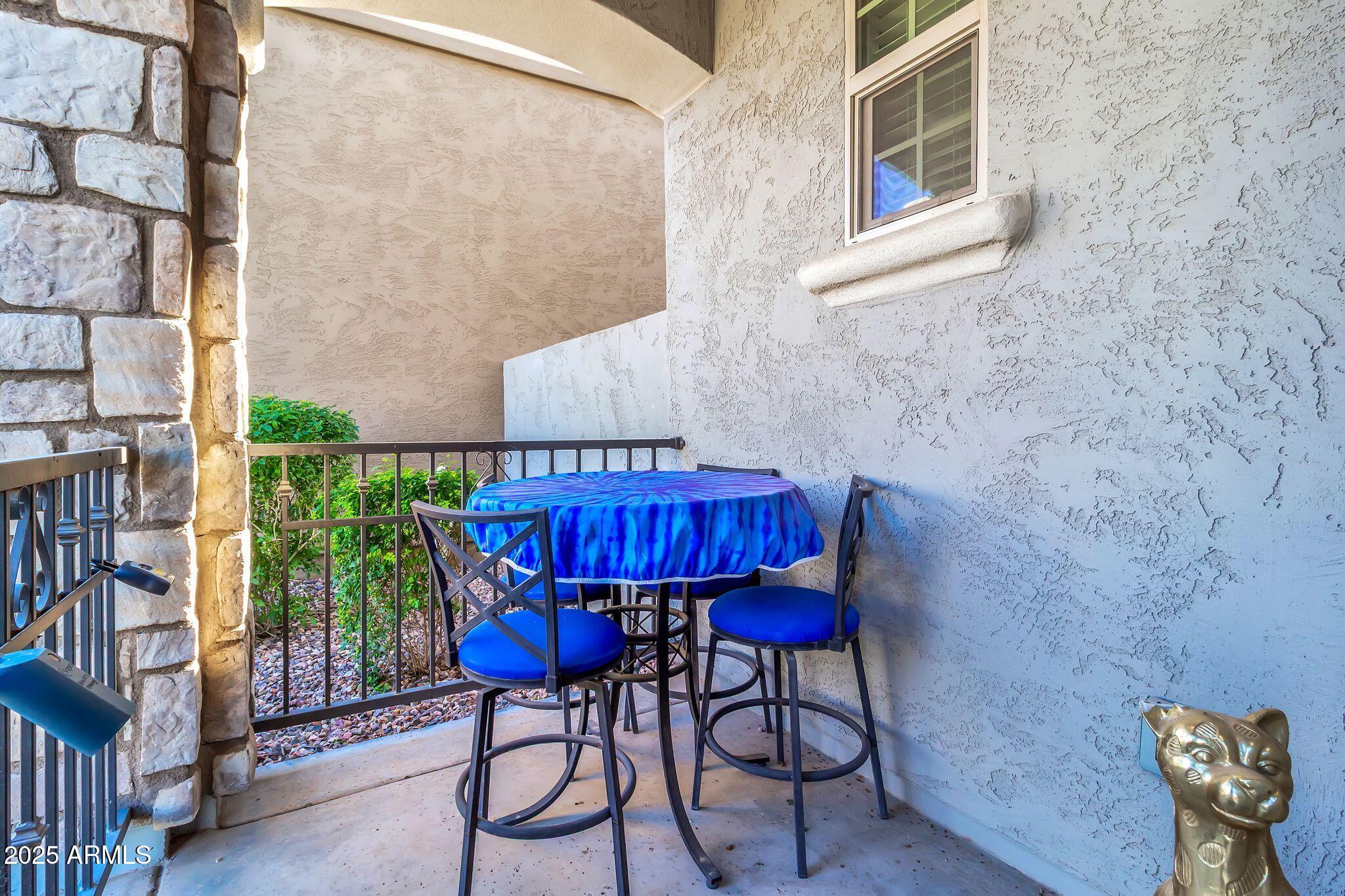 4145 East Bethena Street Gilbert, AZ 85295 - Photo 5 of 60 a view of balcony with table and chairs