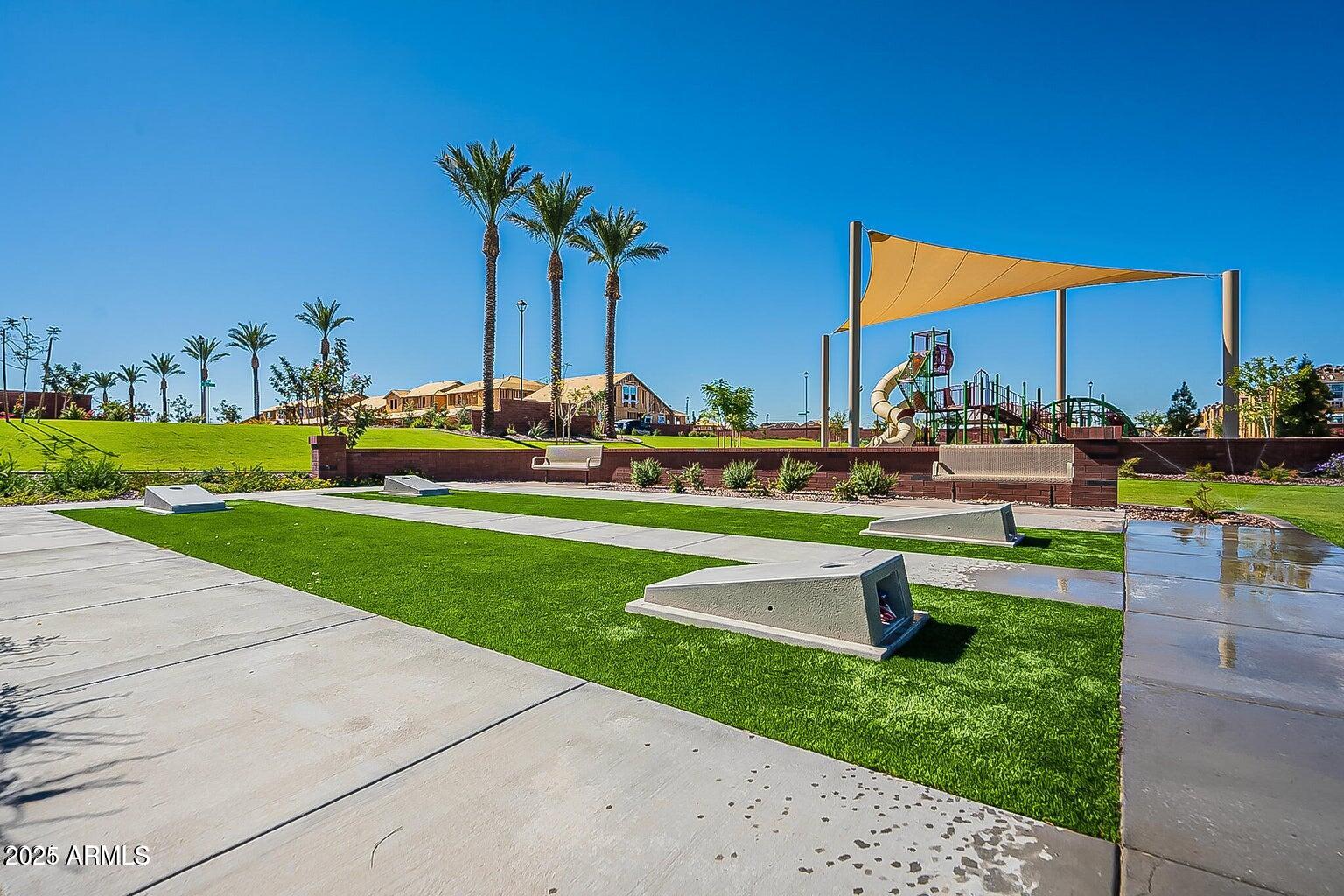 4145 East Bethena Street Gilbert, AZ 85295 - Photo 58 of 60 a view of a swimming pool with a table and chairs
