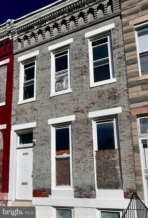 a front view of a building with brick walls