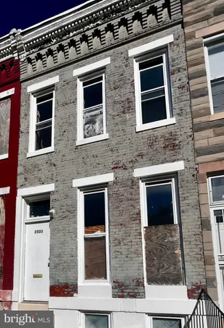 a front view of a building with brick walls