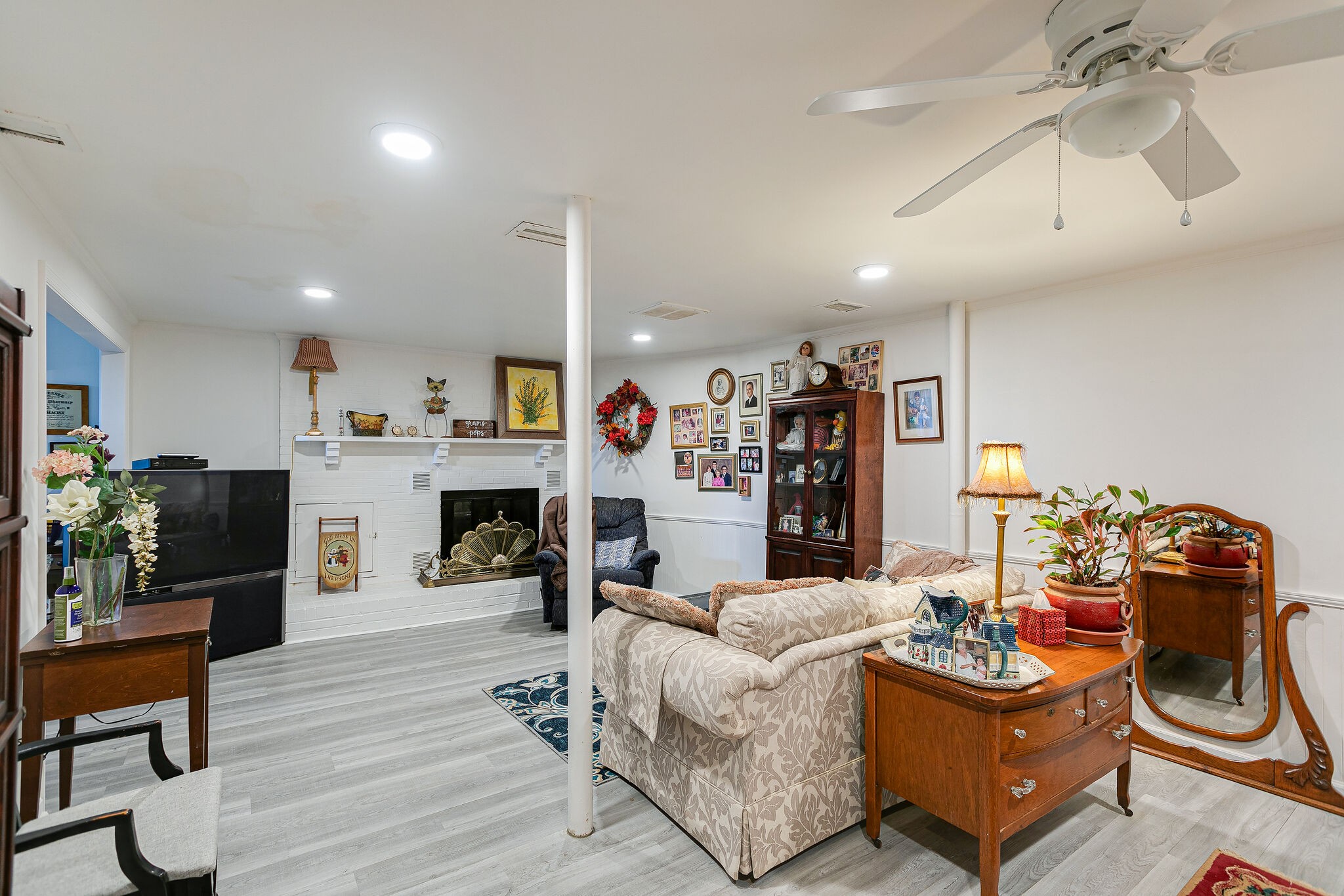 2116 Double Branch Road Columbia, TN 38401 - Photo 17 of 29 a living room with fireplace furniture and a wooden floor