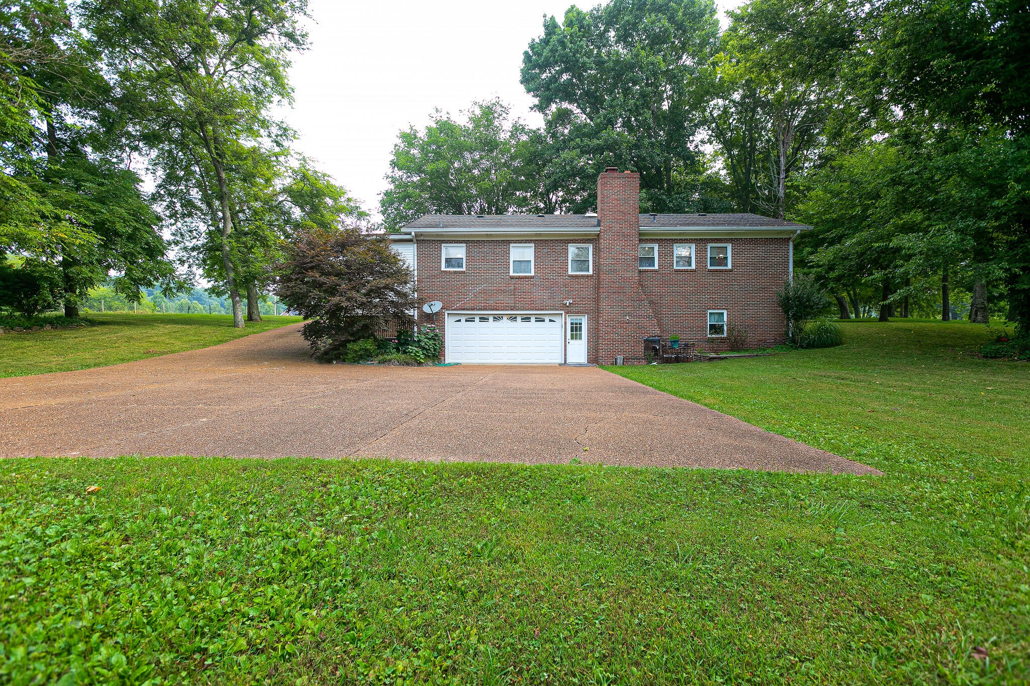 2116 Double Branch Road Columbia, TN 38401 - Photo 27 of 29 a front view of a house with a yard and trees