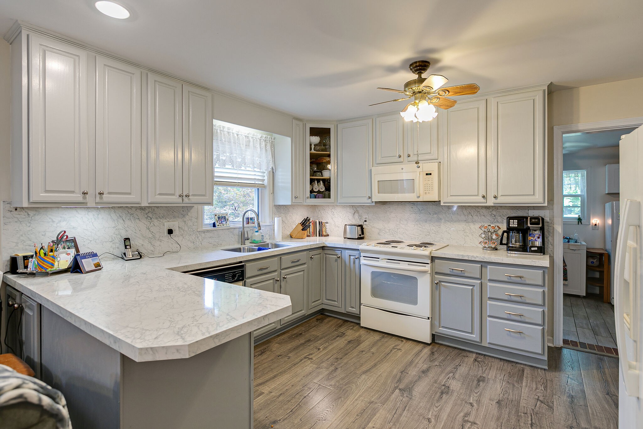 2116 Double Branch Road Columbia, TN 38401 - Photo 9 of 29 a kitchen with cabinets a sink and stainless steel appliances