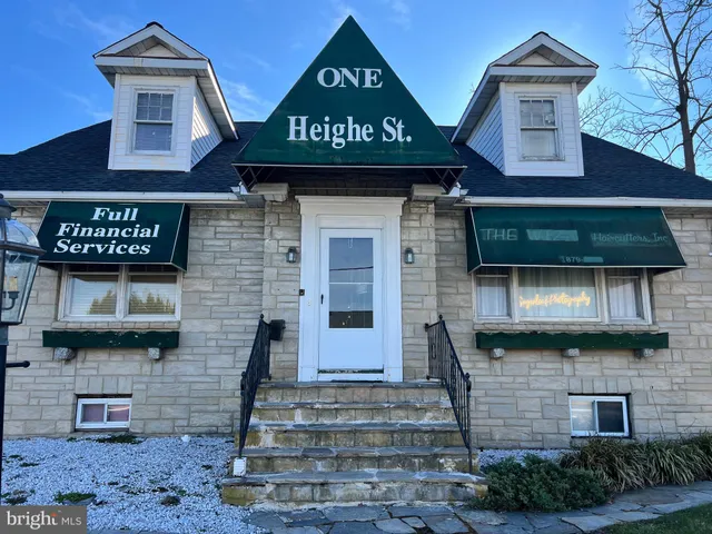 a view of a brick building with many windows
