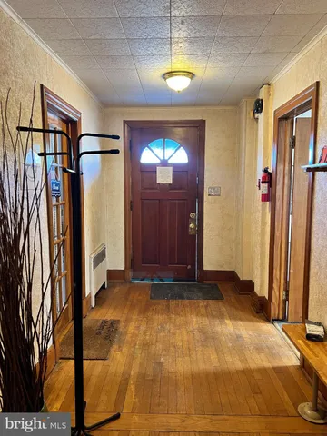 a view of an empty room with a fireplace