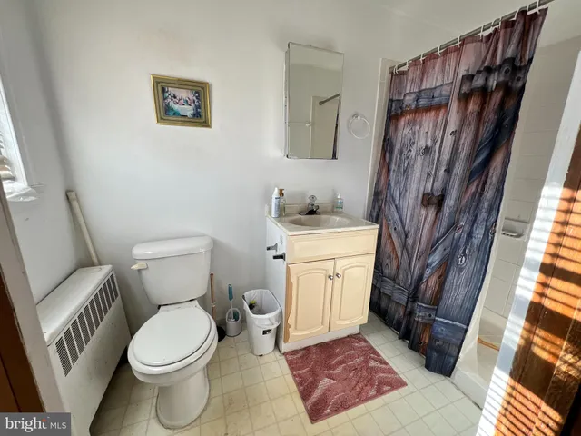 a bathroom with a toilet and a sink
