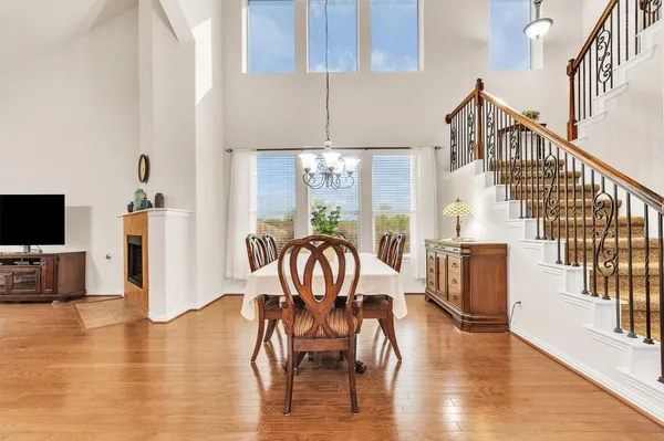 a view of a dining room with furniture window and wooden floor