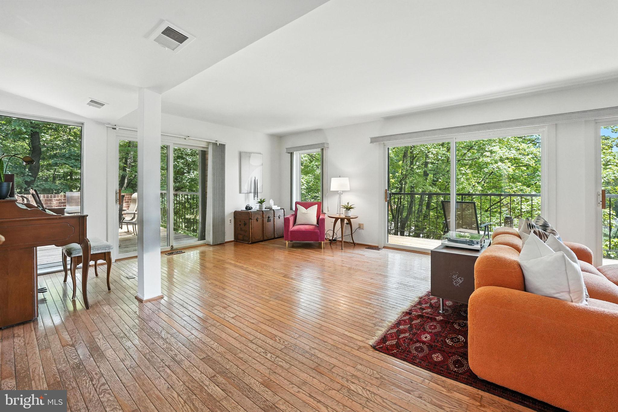 2151 Cabots Point Lane Reston, VA 20191 - Photo 11 of 71 a living room with furniture and a wooden floor
