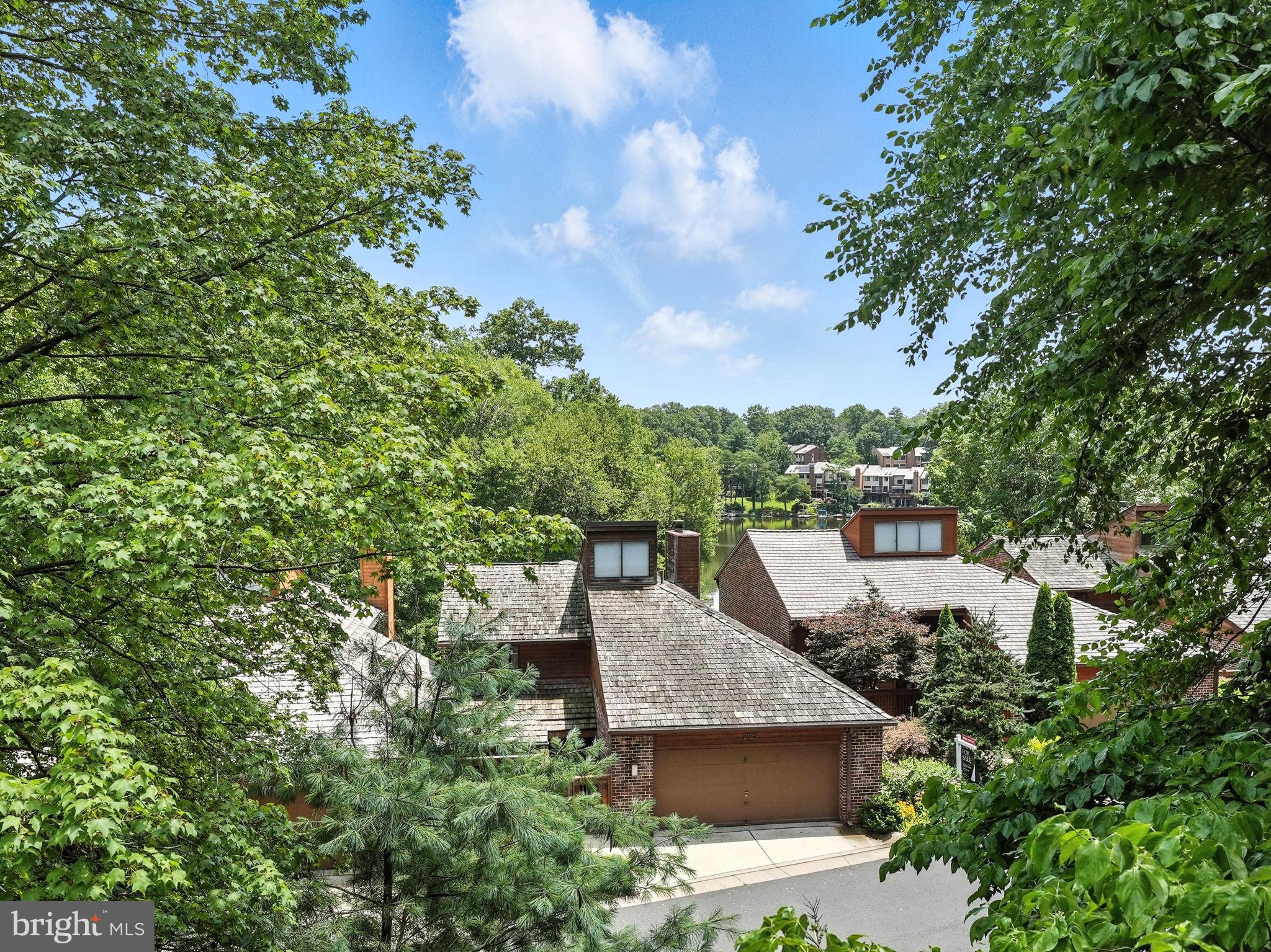 2151 Cabots Point Lane Reston, VA 20191 - Photo 14 of 71 a view of a terrace with a garden and bench
