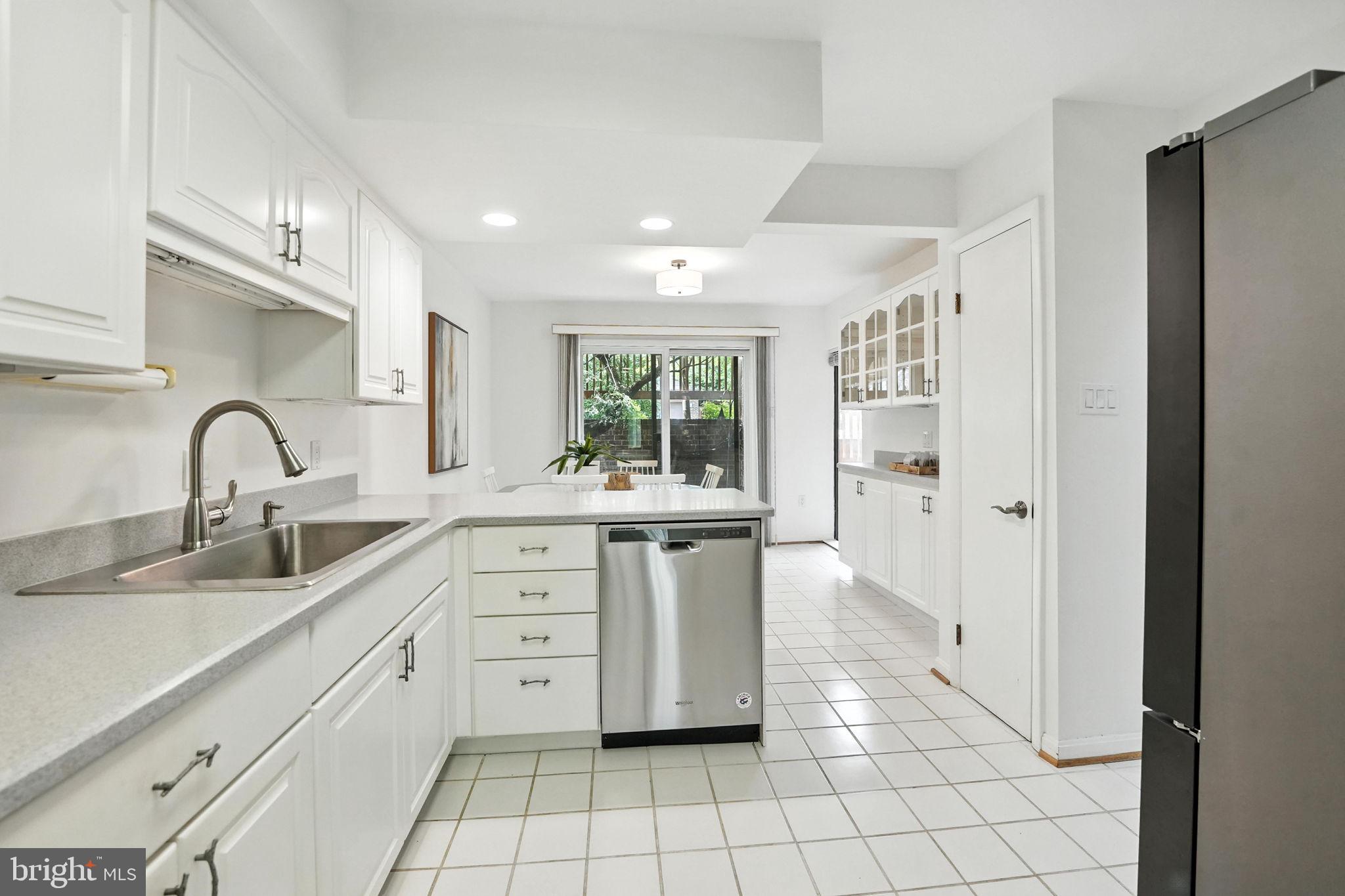 2151 Cabots Point Lane Reston, VA 20191 - Photo 19 of 71 a kitchen with white cabinets and window