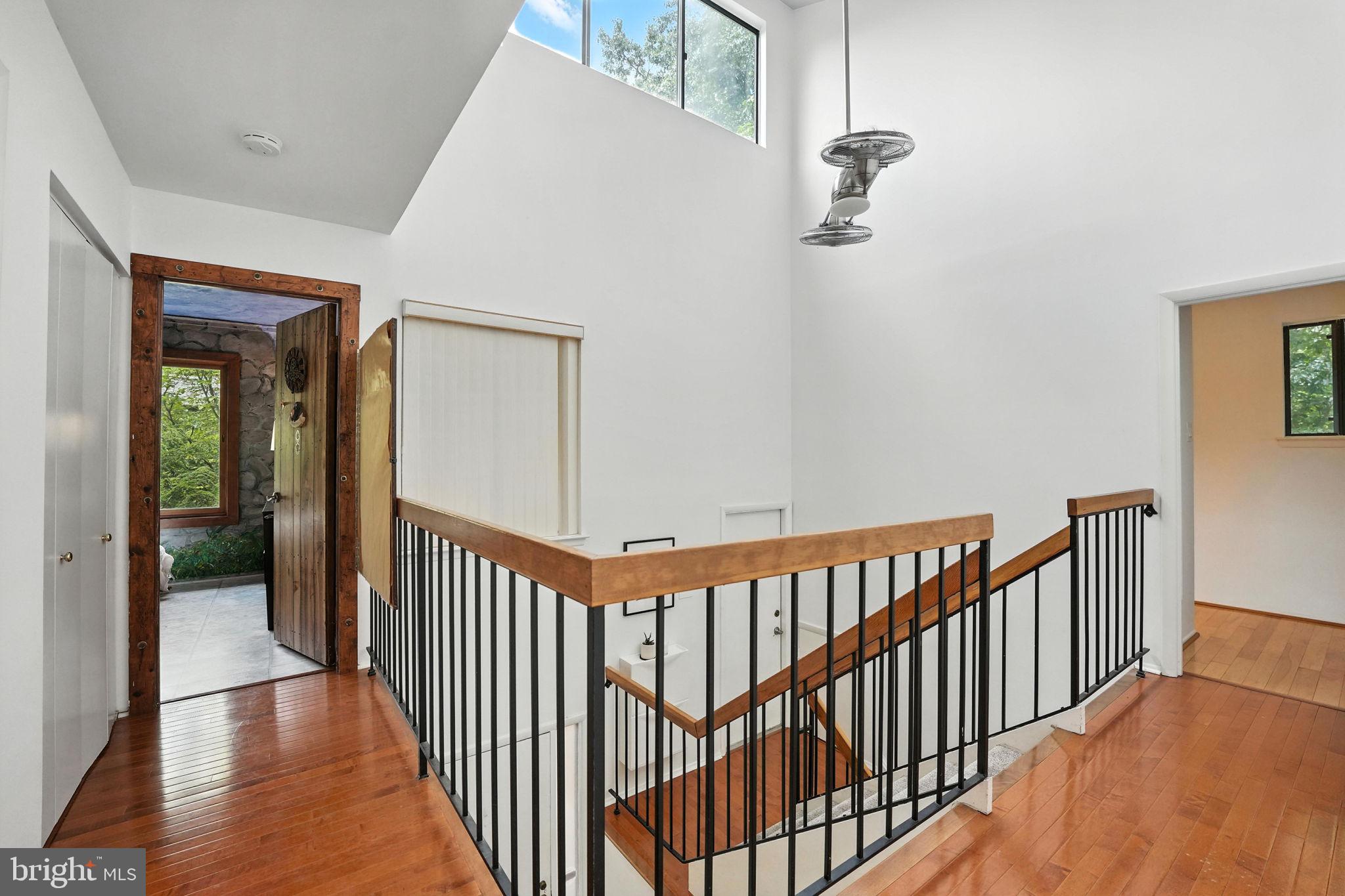 2151 Cabots Point Lane Reston, VA 20191 - Photo 28 of 71 a view of a hallway with wooden floor and staircase
