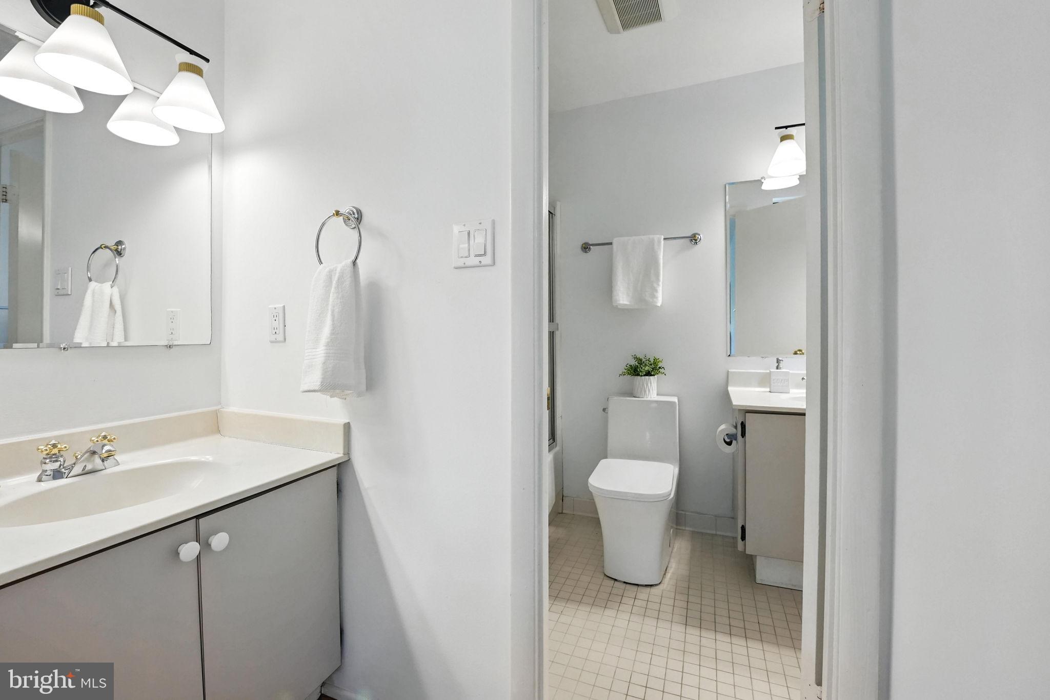 2151 Cabots Point Lane Reston, VA 20191 - Photo 40 of 71 a bathroom with a sink a toilet and shower