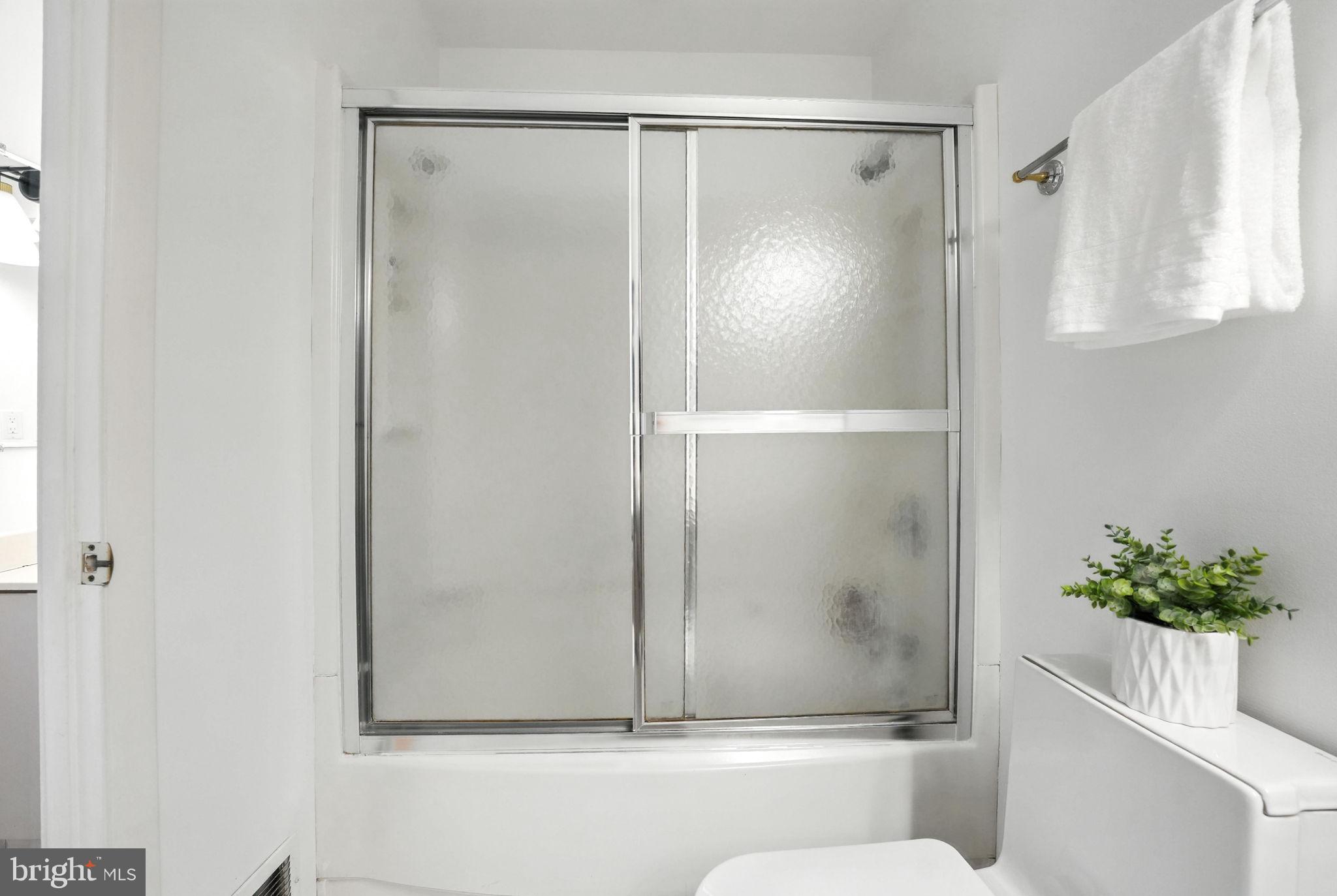 2151 Cabots Point Lane Reston, VA 20191 - Photo 42 of 71 a bathroom with a glass shower door
