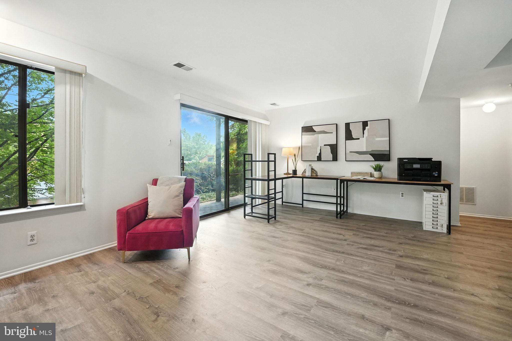 2151 Cabots Point Lane Reston, VA 20191 - Photo 44 of 71 a view of a livingroom with furniture and an empty room