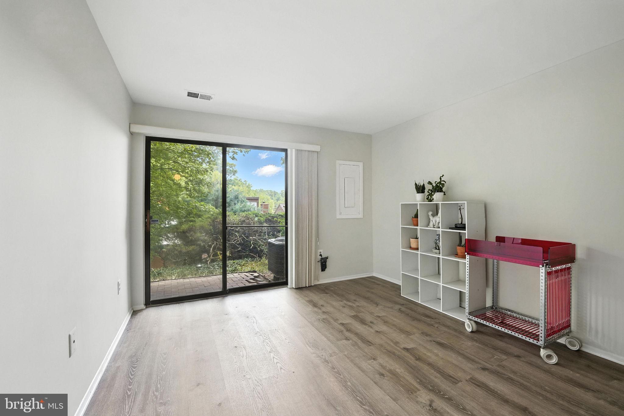 2151 Cabots Point Lane Reston, VA 20191 - Photo 47 of 71 a view of a livingroom with wooden floor and a window