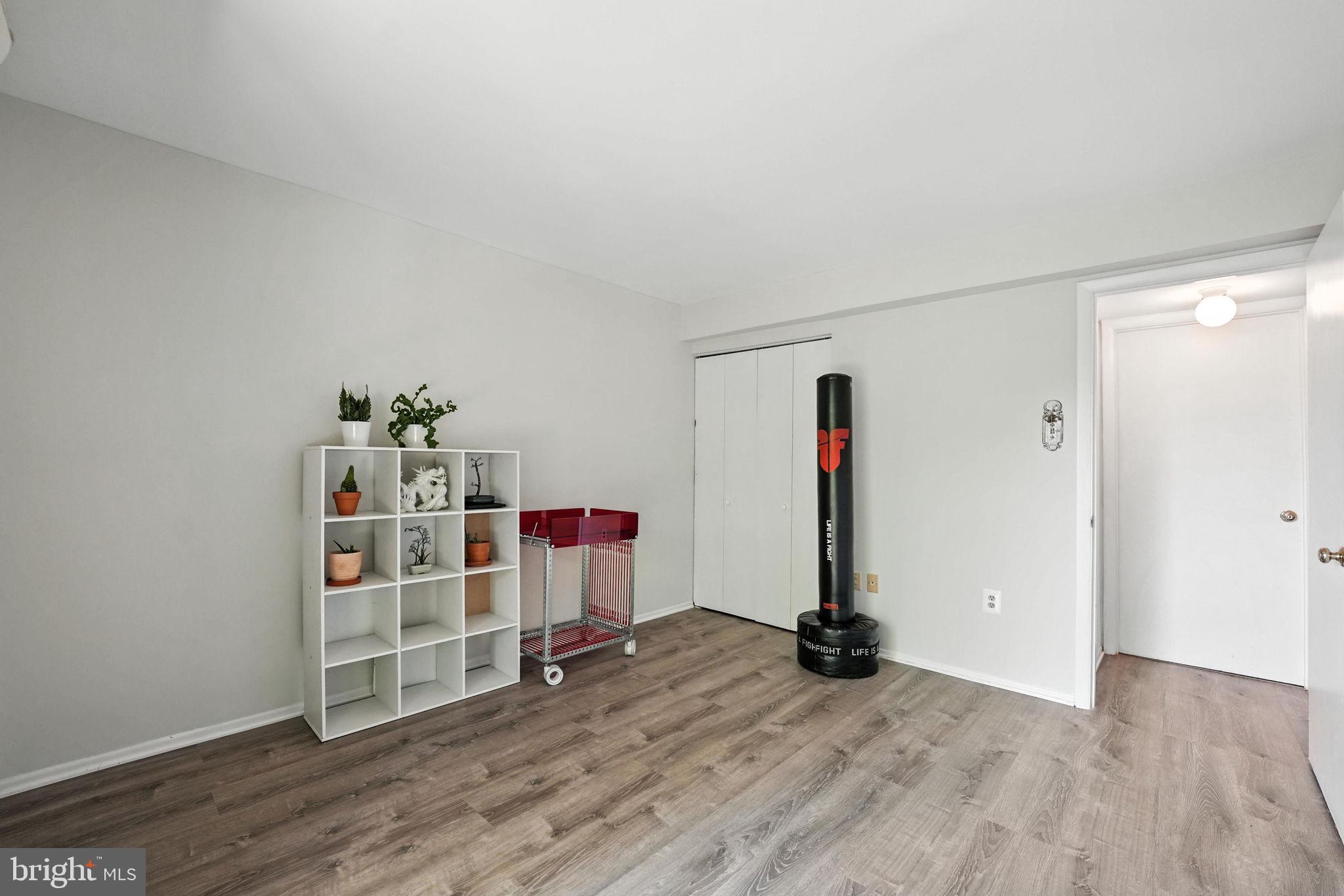 2151 Cabots Point Lane Reston, VA 20191 - Photo 48 of 71 a view of a room with wooden floor and white walls