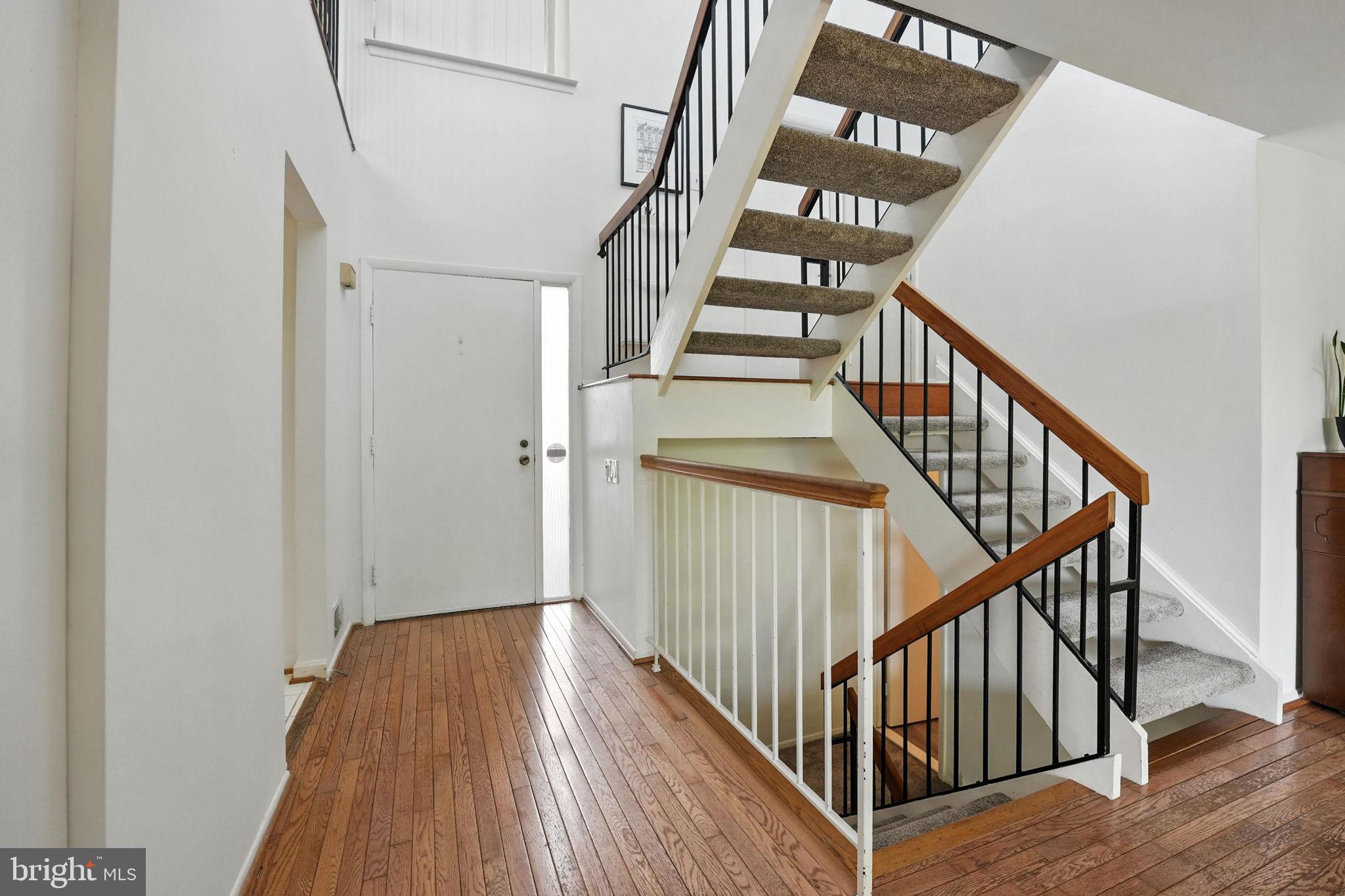 2151 Cabots Point Lane Reston, VA 20191 - Photo 7 of 71 a view of staircase with wooden floor and white walls