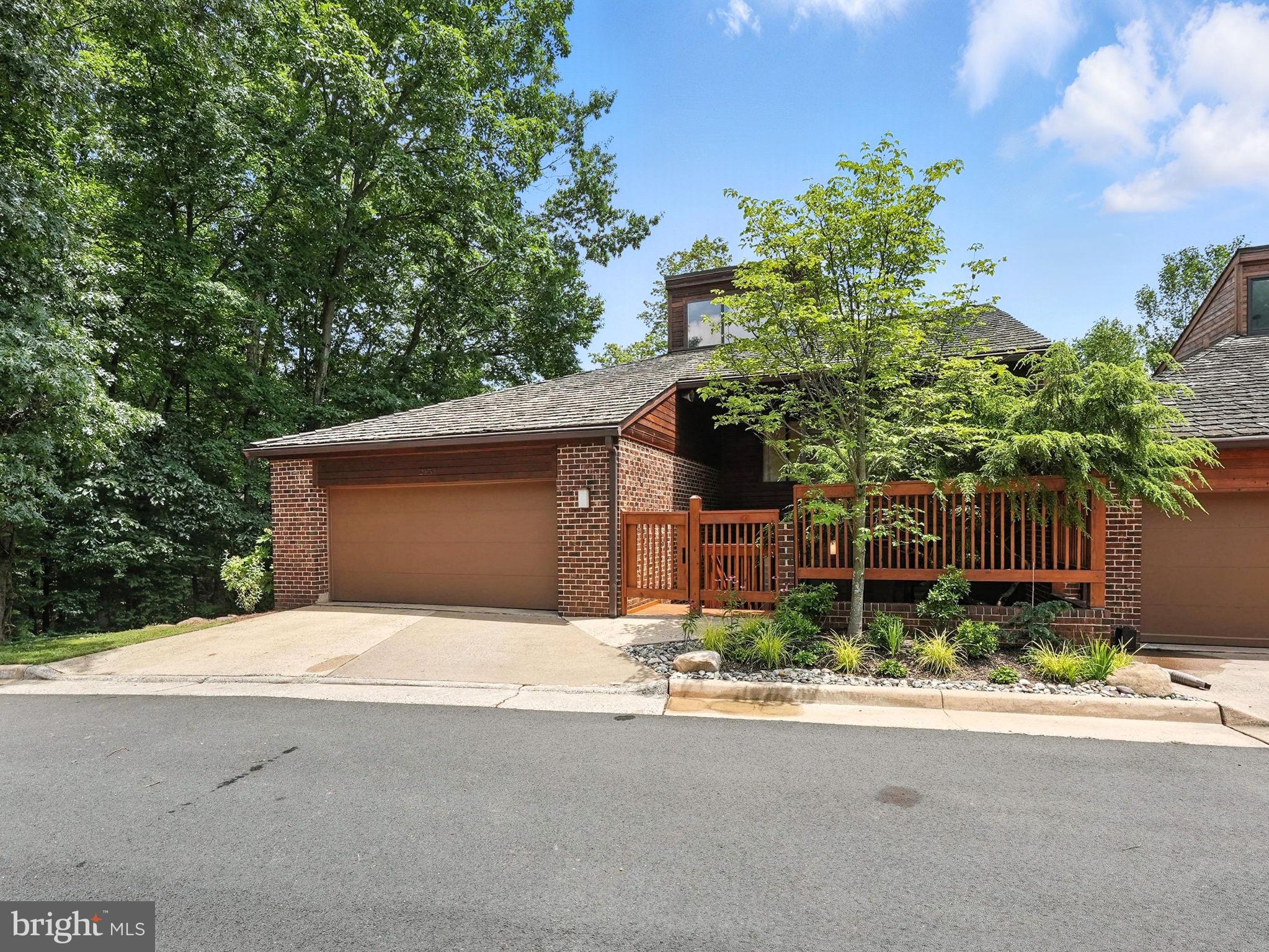 2151 Cabots Point Lane Reston, VA 20191 - Photo 71 of 71 a front view of a house with a yard and garage