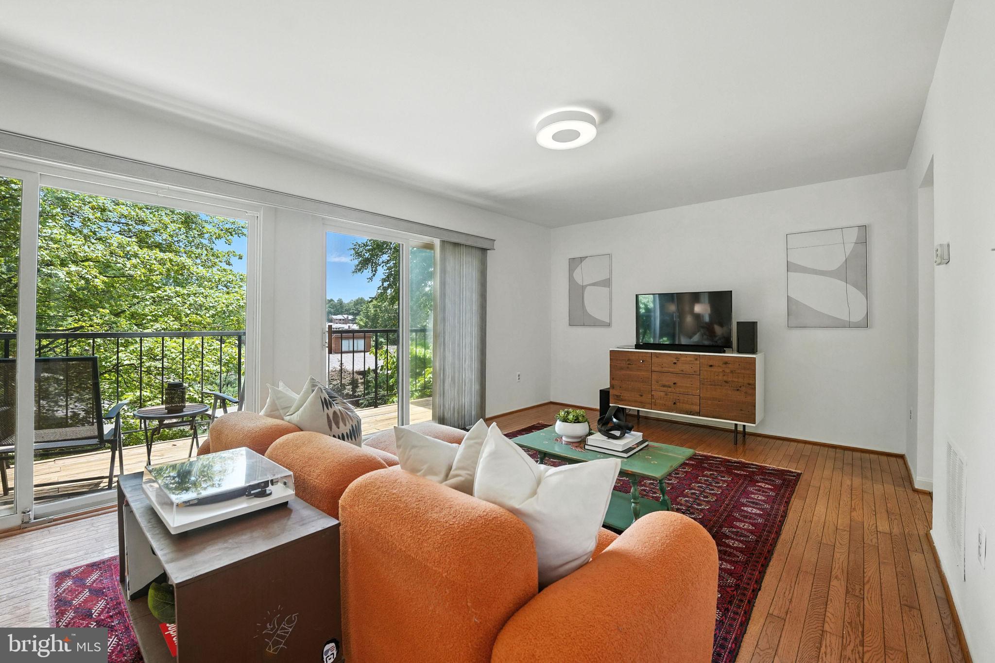 2151 Cabots Point Lane Reston, VA 20191 - Photo 9 of 71 a living room with furniture and a floor to ceiling window