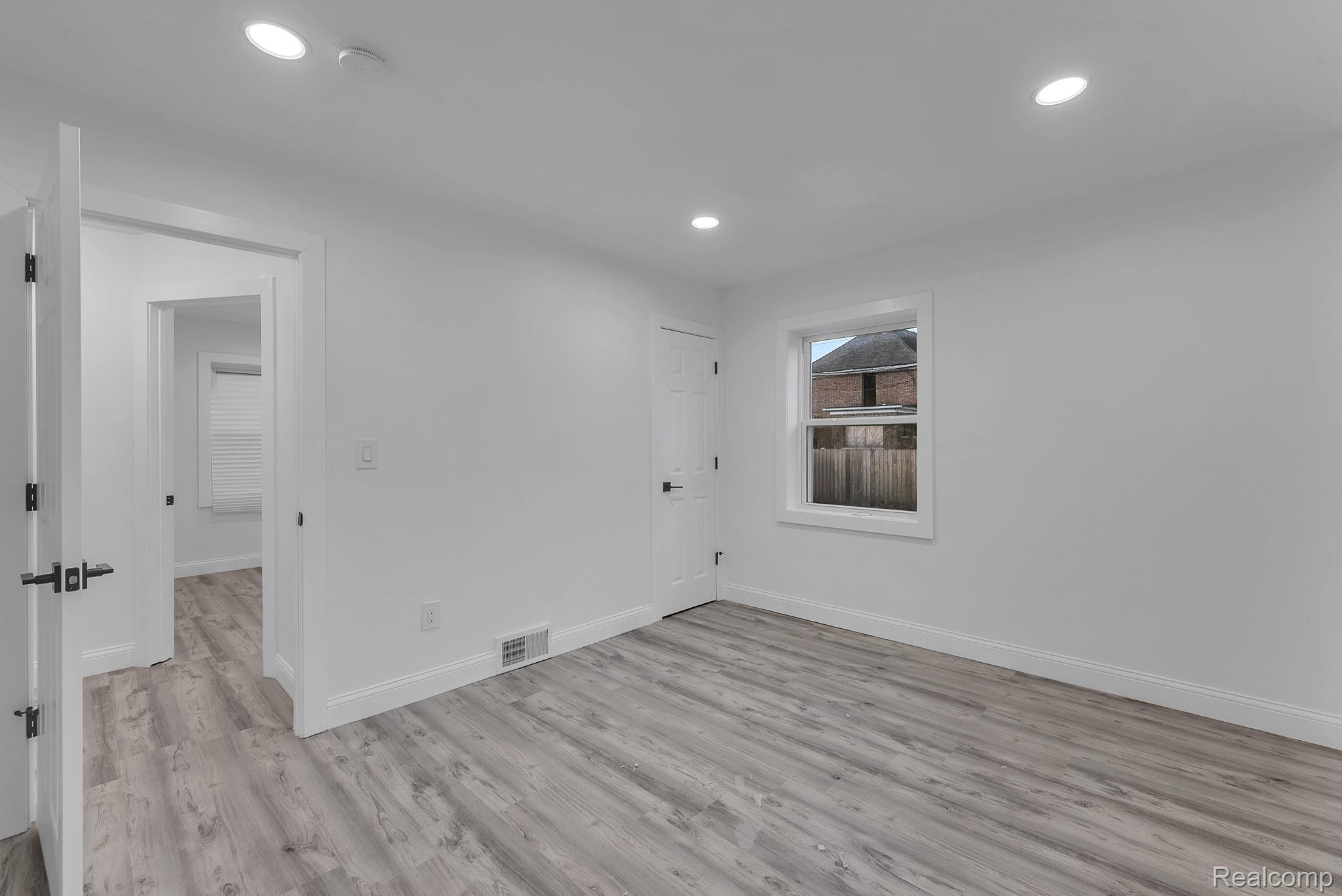 4113 Devonshire Road Detroit, MI 48224 - Photo 12 of 36 Unfurnished room with light wood-style floors and recessed lighting