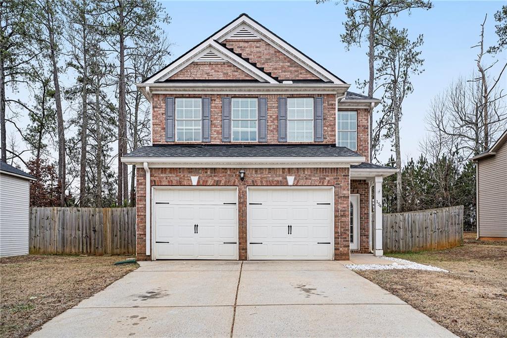 a front view of a house with a garage