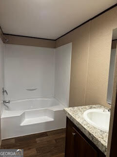 21 Trailer Park Road Hartwell, GA 30643 - Photo 5 of 11 a bathroom with a granite countertop sink and a bathtub