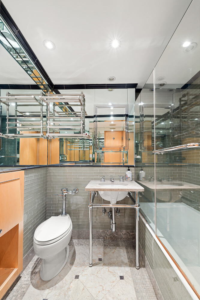120 Central Park South, Unit 6ABC Manhattan, NY 10019 - Photo 11 of 12 a bathroom with a toilet a sink and a shower