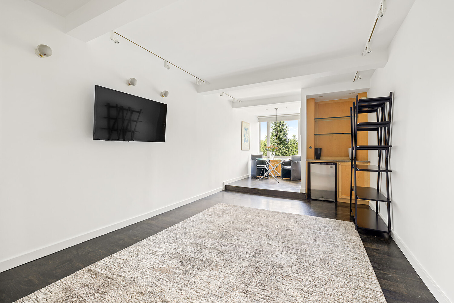 120 Central Park South, Unit 6ABC Manhattan, NY 10019 - Photo 9 of 12 a view of a livingroom with furniture and a flat screen tv