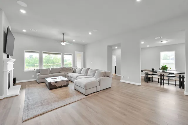 a living room with furniture and a large window