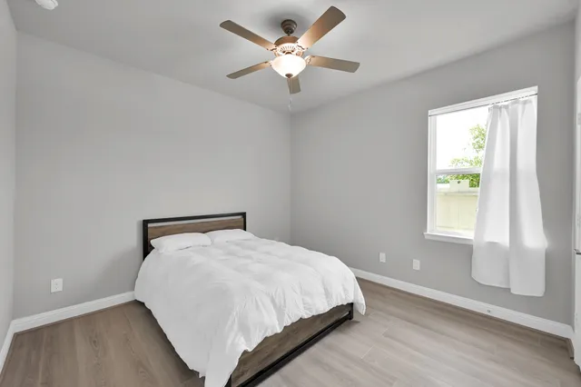 a bedroom with a bed and window