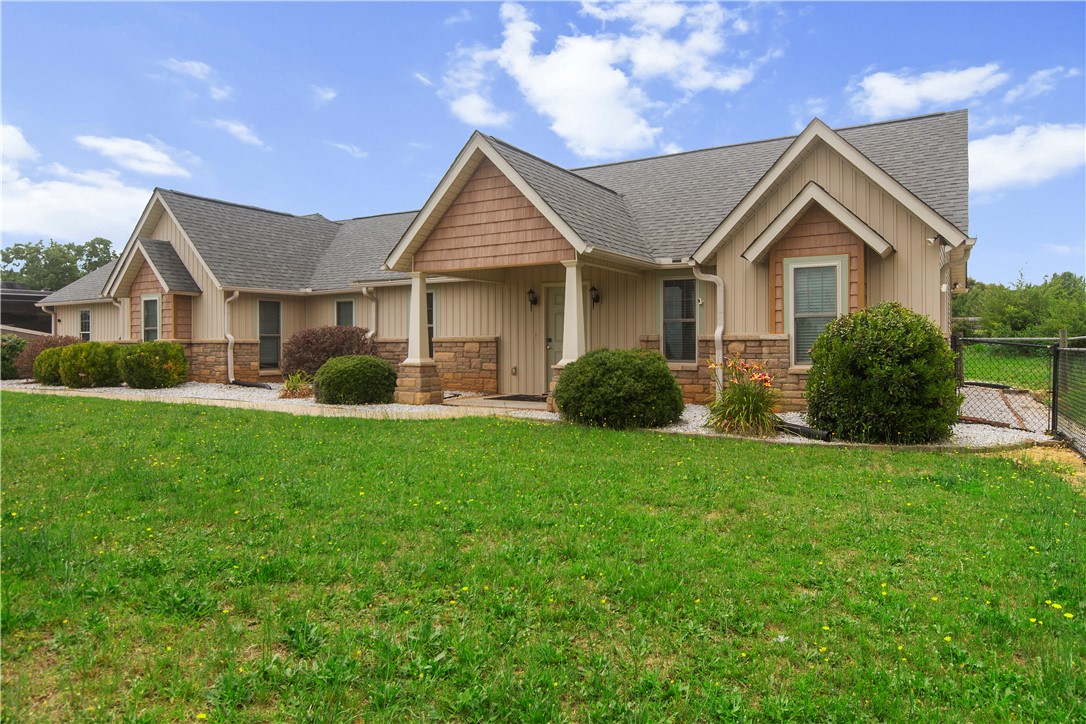 2900 Highway 187 Anderson, SC 29626 - Photo 2 of 41 A welcoming facade showcases a combination of siding and stone, with gabled rooflines adding architectural interest.
