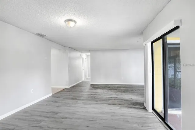 a view of an empty room and window