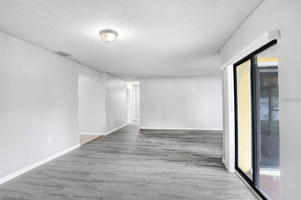 378 Buttonwood Drive Kissimmee, FL 34743 - Photo 9 of 28 a view of an empty room and window