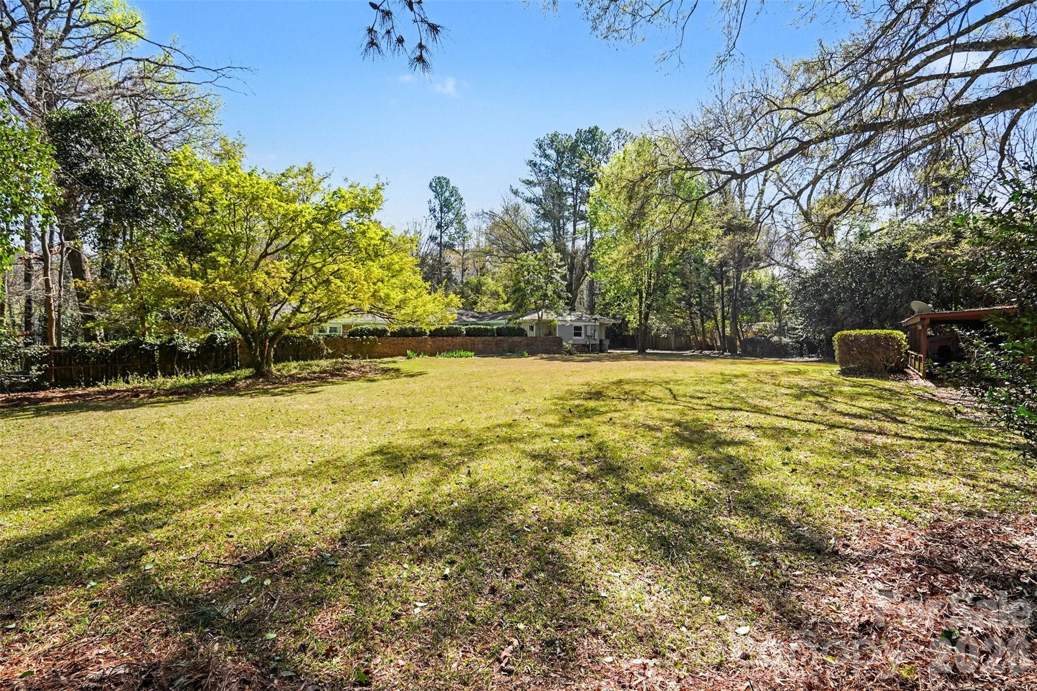 7600 Park Road Charlotte, NC 28210 - Photo 3 of 10 a view of a swimming pool with an outdoor space and seating area