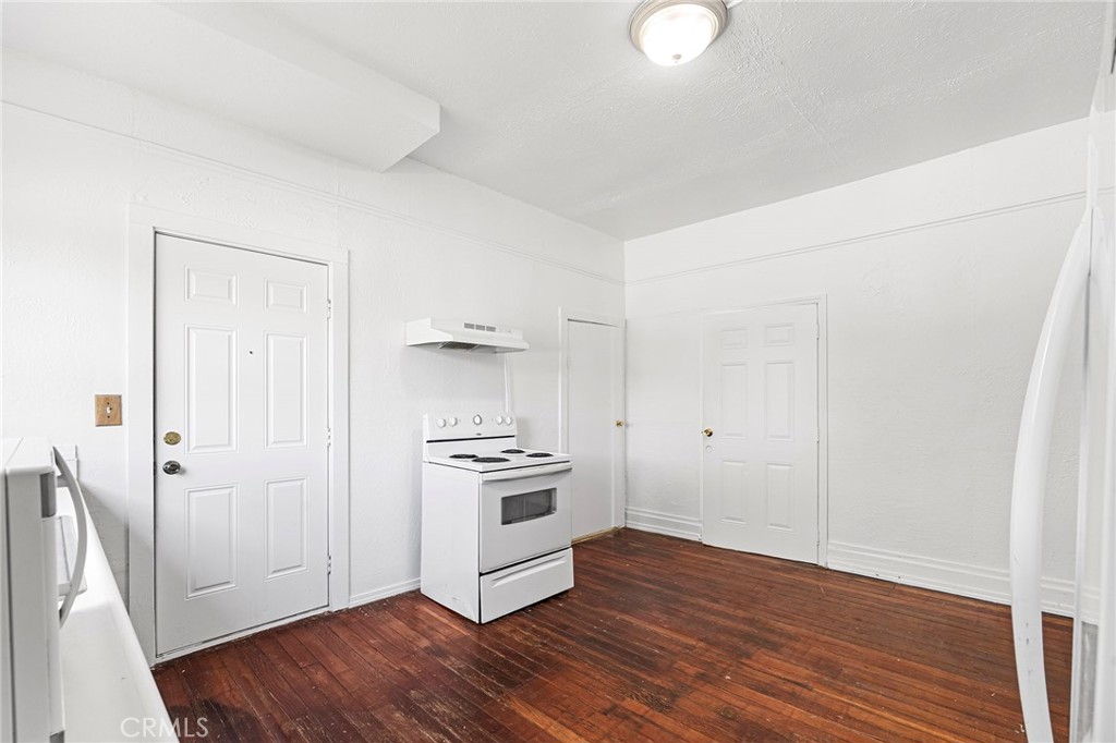 818 6th Street Corning, CA 96021 - Photo 9 of 32 a view of a kitchen with wooden floor and electronic appliances