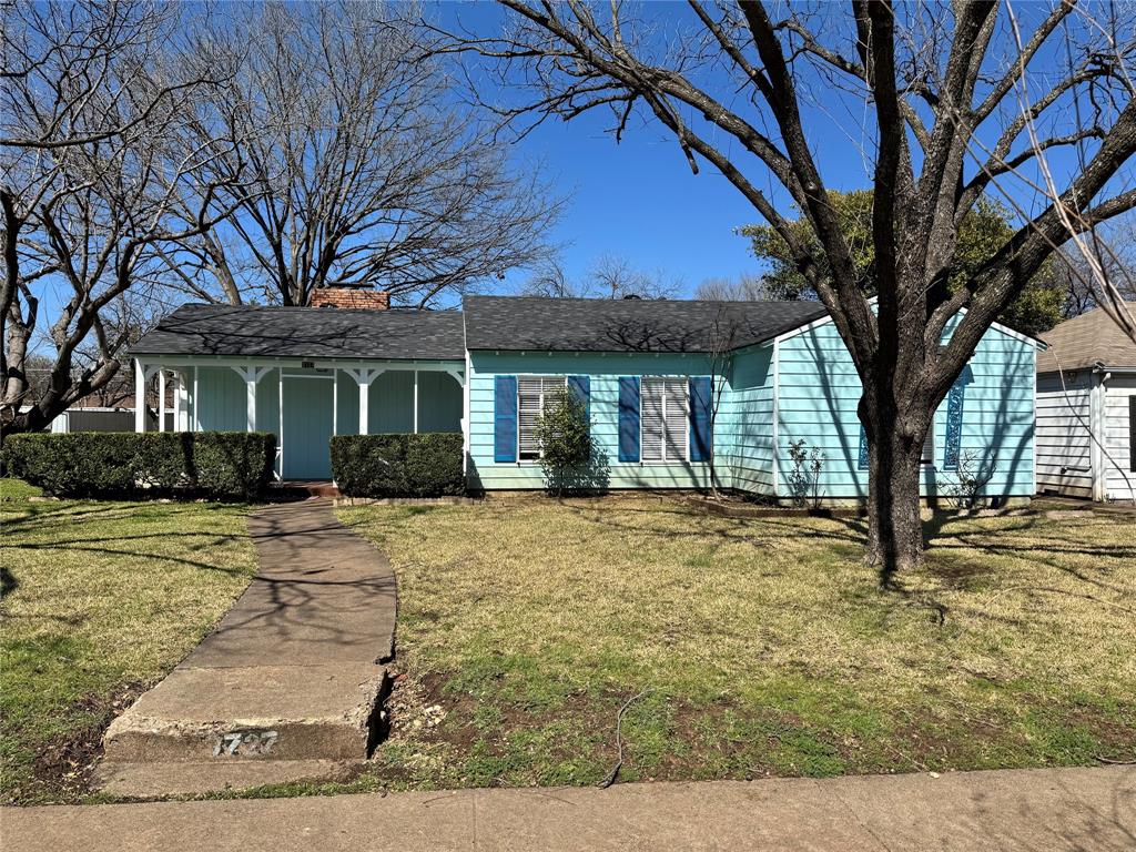3727 Meredith Avenue Dallas, TX 75211 - Photo 1 of 17 a front view of a house with a garden