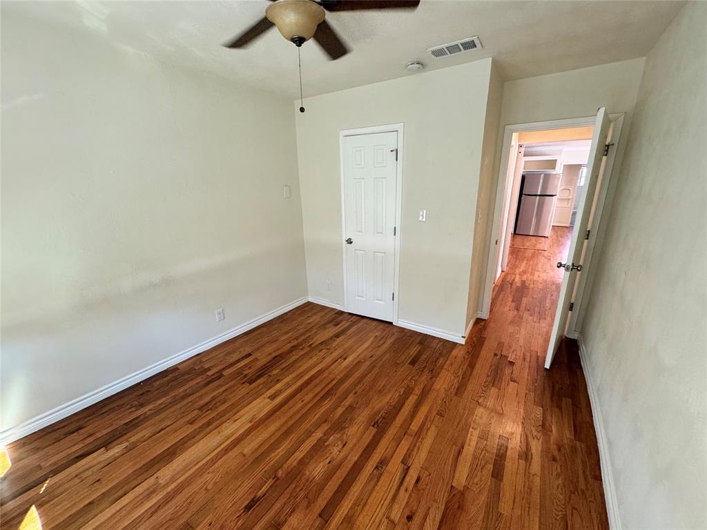 3727 Meredith Avenue Dallas, TX 75211 - Photo 17 of 17 a view of a room with wooden floor and staircase