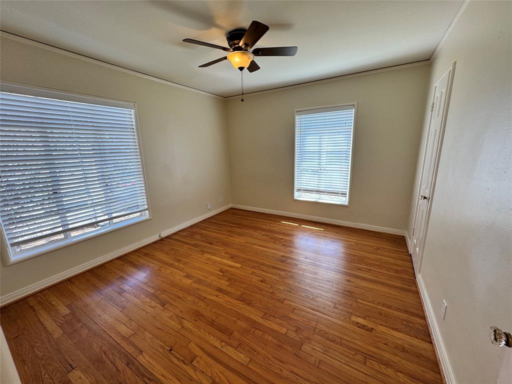 3727 Meredith Avenue Dallas, TX 75211 - Photo 9 of 17 a view of empty room with wooden floor and fan