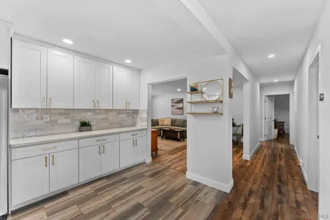 a kitchen with a sink and refrigerator