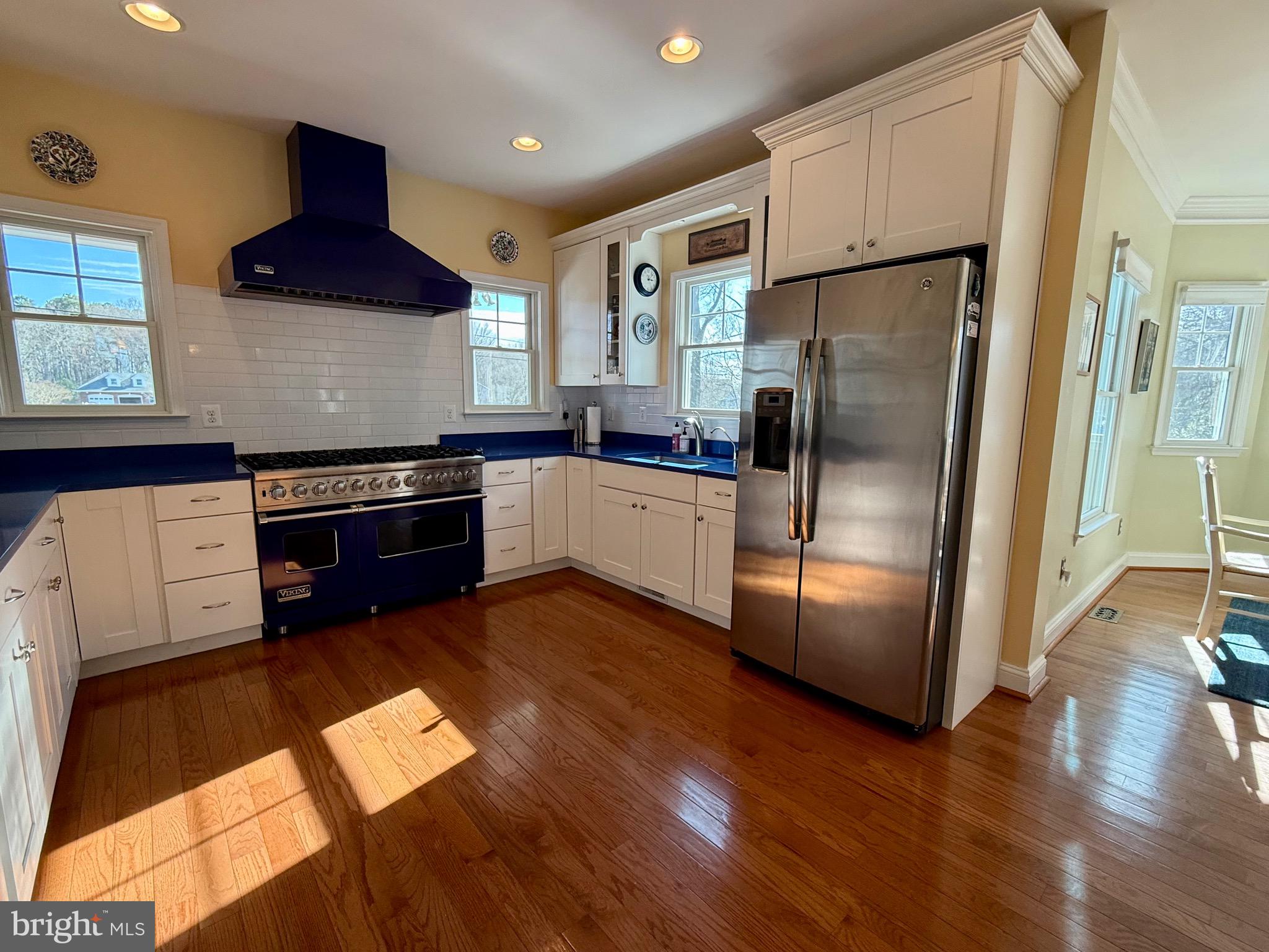 48830 Curleys Road Ridge, MD 20680 - Photo 16 of 65 a kitchen with stainless steel appliances granite countertop a refrigerator a stove a sink and a microwave